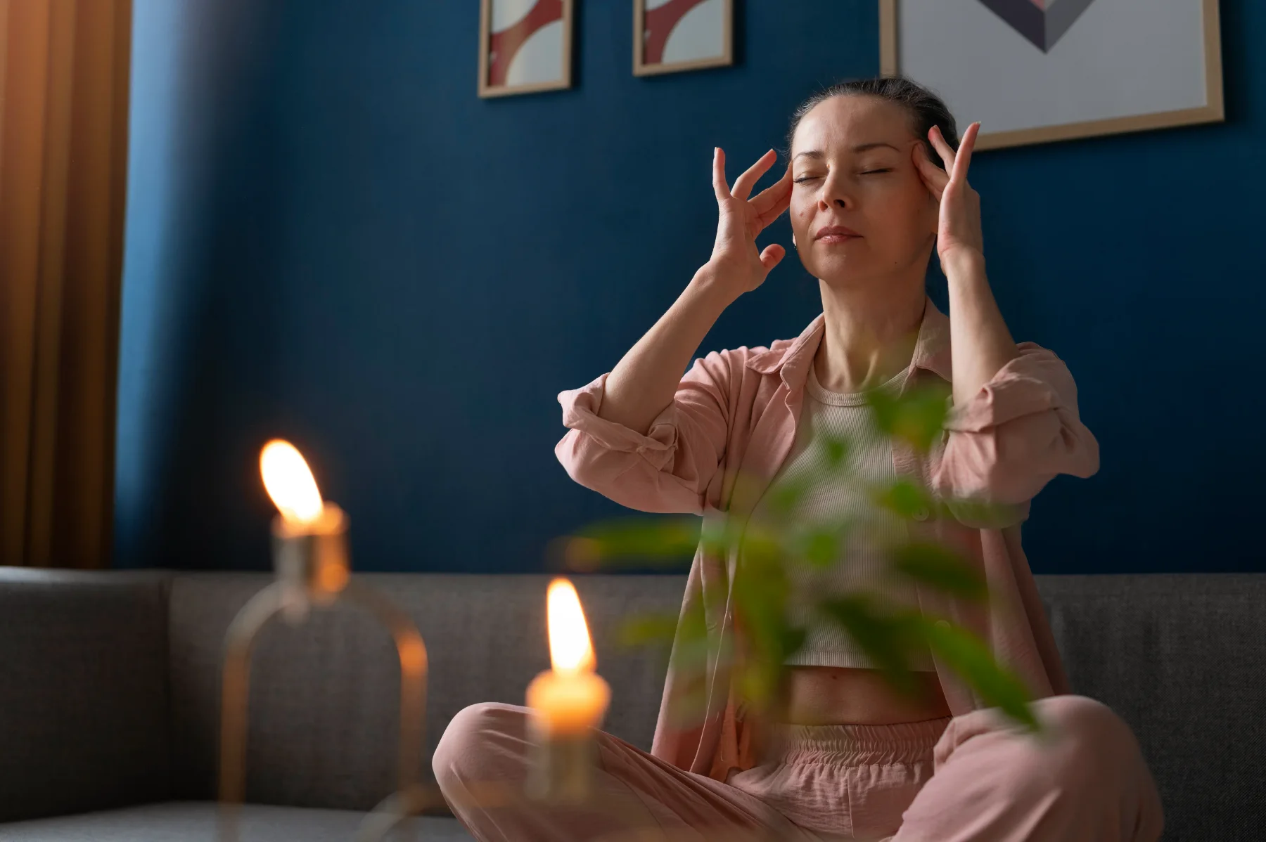 A person sitting quietly with eyes closed in a state of calm, focused attention